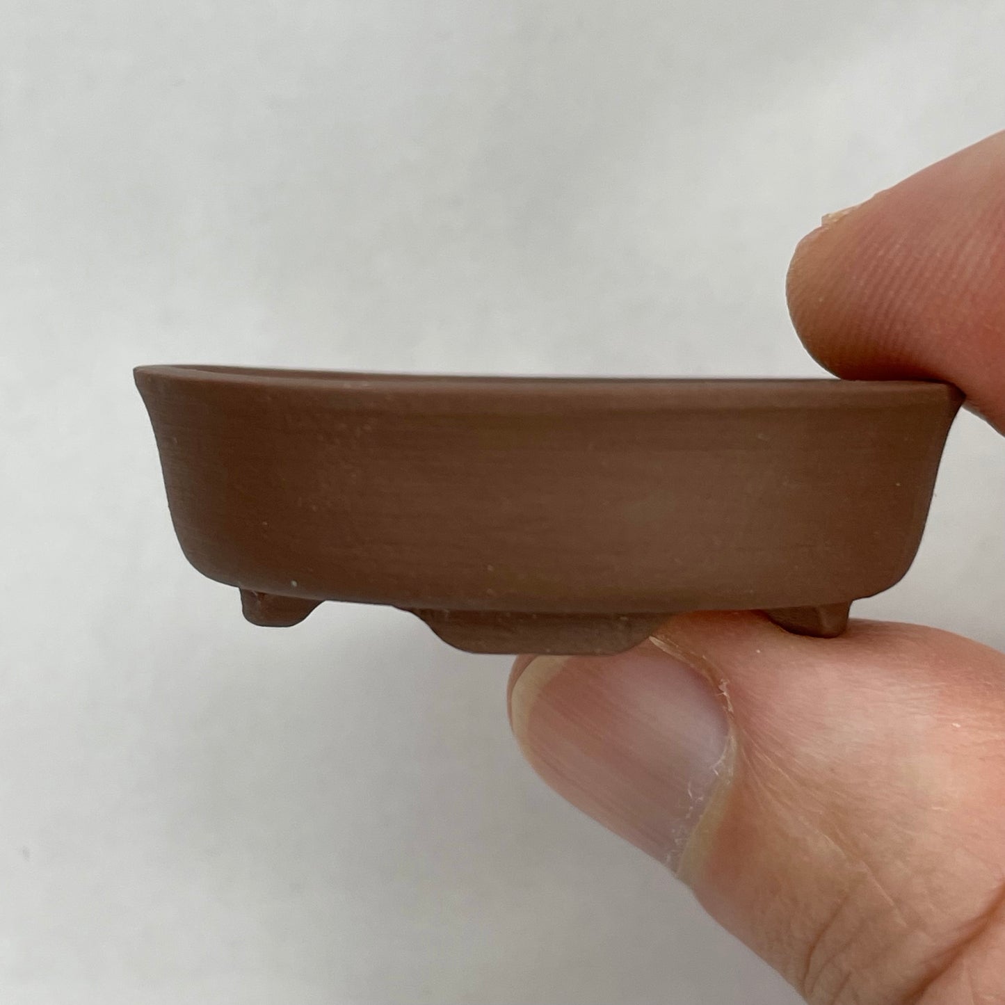 Tiny Unglazed Oval Mame Bonsai Pot in Chocolate Porcelain, A little under 1.75 inches Wide